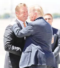  ?? — Reuters photo ?? Trump (right) is greeted by Heller upon arrival in Las Vegas.