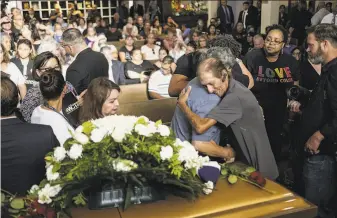  ?? Sandy Huffaker / Getty Images ?? Antonio Basco greets well wishers to a public memorial for his wife, Margie Reckard — one of 22 people killed during the Walmart shooting. Basco invited the public to honor her.