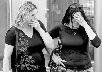  ??  ?? Israeli women (above) whose relatives were among the victims of a bombing in Bulgaria that killed seven people on Wednesday wait for their arrival at the Ben Gurion airport in Tel Aviv, Israel, Thursday.