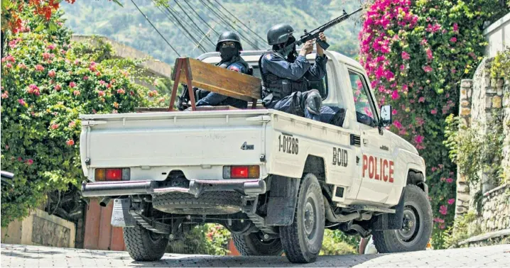  ??  ?? Police patrol the Taiwan embassy in Port-au-Prince, Haiti, where 11 suspects were arrested over the murder of President Jovenel Moise