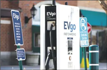  ?? ASSOCIATED PRESS ?? A EVgo electric vehicle charging station is seen Wednesday at Willow Festival shopping plaza parking lot in Northbrook, Ill.