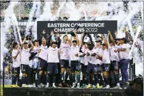  ?? CHRIS SZAGOLA — THE ASSOCIATED PRESS ?? Union defender Kai Wagner, center, lifts the trophy after the Union beat New York City FC in the Eastern Conference final last year.