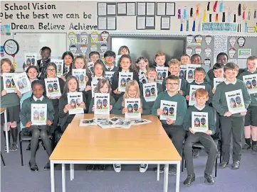  ?? ?? CLASS ACT: The pupils at St Ninian’s Primary School with their new book Avatar ME.