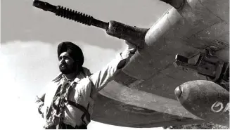  ??  ?? Sqn Ldr Dalip Singh with Hurricane Mk.IIC of No.4 Squadron, IAF on the Burma Front