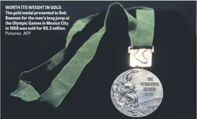  ?? Pictures: AFP ?? WORTH ITS WEIGHT IN GOLD. The gold medal presented to Bob Beamon for the men’s long jump at the Olympic Games in Mexico City in 1968 was sold for R8.3 million.