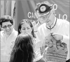  ??  ?? Peru’s President Pedro Pablo Kuczynski (right) visits Cantagallo, an indigenous Shipibo-Konibo community, in Lima, Peru. — Reuters photo