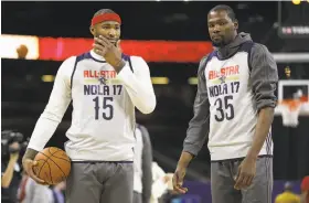  ?? Ronald Martinez / Getty Images 2017 ?? DeMarcus “Boogie” Cousins (left) and Kevin Durant are among the All-Stars in the lineup spurring more envy and resentment of the Golden State Warriors.