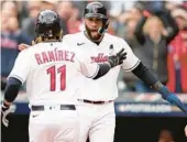  ?? MATTHEW STOCKMAN/GETTY ?? Guardians’ José Ramírez, left, celebrates with Amed Rosario after hitting a two-run homer against the Rays in Game 1 on Friday in Cleveland.