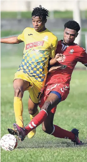  ??  ?? Harbour View’s Peter-Lee Vassell (left) dribbles by UWI FC’s Patrick Brown in their Red Stripe Premier League opener at the UWI Mona Bowl on Thursday, September 20, 2018.