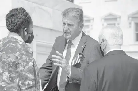  ?? J. SCOTT APPLEWHITE/AP ?? Sen. Joe Manchin, D-W.Va., center, shown Saturday with Rep. Sheila Jackson Lee, D-Texas, and Rep. Mike Thompson, D-Calif., has said that President Joe Biden’s $3.5 trillion spending plan will have to be pared back.