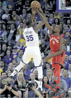  ?? BEN MARGOT/AP PHOTO ?? The Raptors’ Serge Ibaka, right, gets a block on the Warriors’ Kevin Durant on Wednesday.