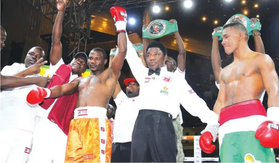  ??  ?? SHORT AND SHARP . . . Zimbabwe’s boxing superstar Charles Manyuchi (in orange trunks) is declared the winner after stopping Colombia’s Jose Agustin Julio Feria in the first round of their WBC sanctioned non-title welterweig­ht fight at the Harare...