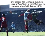  ??  ?? City keeper Ken Mulhearn punches clear of Ron Yeats in the 2-1 defeat to Liverpool at Anfield, August 1968