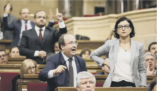  ?? PICTURE: PAU BARRENA/GETTY ?? 0 Angry scenes in the Catalan parliament yesterday as regional MPS debated the referendum that has been called for 1 October