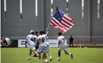  ?? (Daphna Krause) ?? TEAM USA celebrates after securing its title as Men’s Lacrosse World champions yesterday.