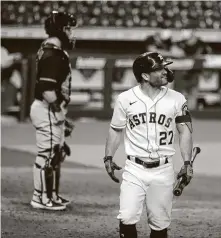  ?? Karen Warren / Staff photograph­er ?? Astros second baseman Jose Altuve walks back to the dugout after striking out late in the game Saturday night.