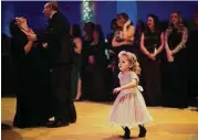  ?? Marie D. De Jesús / Houston Chronicle ?? Adaleigh Ross, 2, dances at the 2017 Black Tie and Boots Presidenti­al Inaugurati­on Ball in Oxen Hill, Md.
