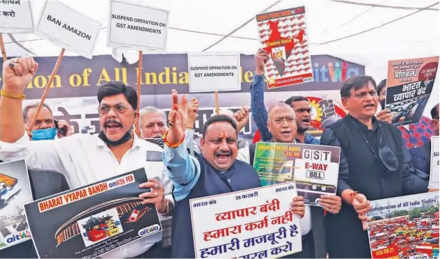  ?? Associated Press ?? ↑
Traders take part in a protest against the Goods and Services Tax and rise in fuel prices in New Delhi on Friday.