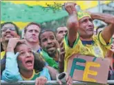  ?? SERGIO MORAES / REUTERS ?? Fans in Rio de Janeiro react as they watch the telecast of Sunday’s World Cup Group E match between Brazil and Switzerlan­d in Rostov-on-Don, Russia. The match ended in a 1-1 draw.
