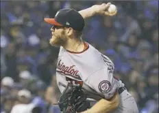  ??  ?? Not expected to start because of illness, Stephen Strasburg pitched seven shutout innings and struck out 12 to help keep the Nationals alive.