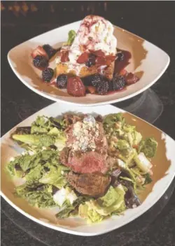  ?? STAFF PHOTO BY TIM BARBER ?? Firebirds offers new seasonal entrees of Grilled Tenderloin Salad and Ooey Gooey Butter Cake for dessert.