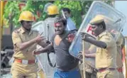  ?? AFP FILE ?? Cops detain an injured protester at a demonstrat­ion against the Supreme Court order banning Jallikattu in Chennai.