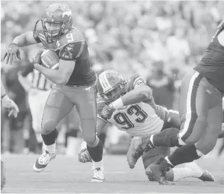  ?? Leah Hennel/Calgary Herald/Files ?? Calgary Stampeders’ tailback Jon Cornish, left, has carried the ball 215 times for 1,545 yards this season.