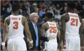  ?? MARY ALTAFFER — THE ASSOCIATED PRESS ?? Syracuse head coach Jim Boeheim, second from left, gestures as his team comes in to the bench during a time out in the second half of an NCAA college basketball game against the Miami in the Atlantic Coast Conference tournament, March 8 in New York....