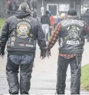  ?? FRAM DINSHAW/TRURO NEWS ?? Two dismounted bikers enjoyed a relaxed stroll in Victoria Park as the Blessing of the Bikes ceremony got underway.