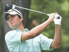  ??  ?? Winner Easton Renwick tees off on No. 18 in a playoff Wednesday against Mike Van Sickle.