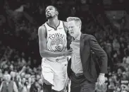  ?? Steve Dykes / Associated Press ?? Kevin Durant, left, helps escort Warriors coach Steve Kerr after Kerr was ejected against Portland.