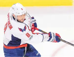  ?? PAUL CHIASSON/ASSOCIATED PRESS ?? Capitals left wing Alex Ovechkin (8) fires a shot to score a power-play goal against the Montreal Canadiens during the third period on Monday.