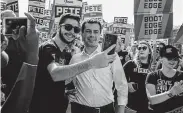  ?? Jordan Gale / New York Times ?? Mayor Pete Buttigieg of South Bend, Ind., takes a selfie with a fundraiser attendee in Clear Lake, Iowa.