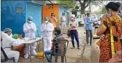  ??  ?? Doctors examine the residents of Vallabh Nagar locailty, in Bhopal