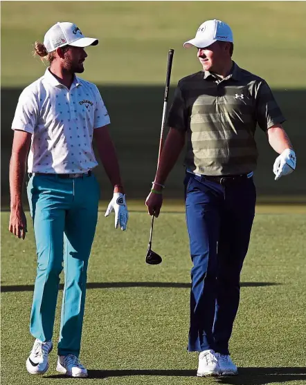  ??  ?? In the mix: Amateur Curtis Luck (left) and Jordan Spieth having a chat as they walk down the fairway on the 12th hole in the first round of the Australian Open at the Royal Sydney Golf Club in Sydney yesterday. — EPA