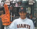  ?? Courtesy Ritchey family ?? Dubon, during his first summer in the U. S., attended several Giants games, dressed as a fan with much memorabili­a.