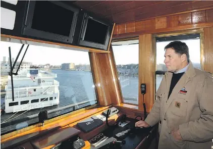  ?? BARBARA HADDOCK TAYLOR/BALTIMORE SUN PHOTO ?? Capt. Jim Demske of Vane Brothers Co. stands in the pilothouse of its latest tug, the nearly finished Hunting Creek, in Salisbury.