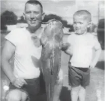  ?? Photo courtesy of Tony Buzbee ?? Gene Buzbee shows off a catfish with his son, Anthony Buzbee, in this family photo taken around 1970. Tony Buzbee learned about hard work from his dad, who was a meat cutter for Safeway for 37 years.