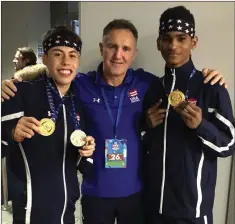  ??  ?? Mark Castro (bantamweig­ht) and Delante Johnson (lightweigh­t) with Billy Walsh.