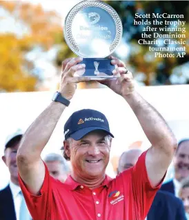  ??  ?? Scott McCarron holds the trophy after winning the Dominion Charity Classic tournament Photo: AP