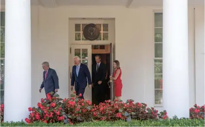  ?? Stephen Crowley / New York Times ?? Above, from left, Senate Majority Leader Mitch McConnell and Sens. John Cornyn and John Thune leave the White House on Wednesday after a meeting on health care legislatio­n. At right, President Donald Trump is flanked by Sens. Dean Heller, left, and Tim...