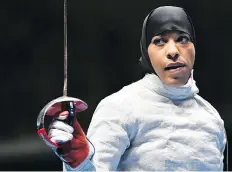  ?? FABRICE COFFRINI/AFP/GETTY IMAGES ?? Fencer Ibtihaj Muhammad became the first American to win an Olympic medal wearing the head scarf.