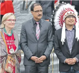  ?? ED KAISER ?? From left, federal Indigenous and Northern Affairs Minister Carolyn Bennett, federal Infrastruc­ture Minister Amarjeet Sohi and Enoch Cree Chief Billy Morin mark the launch of the new Canada Child Benefit on Wednesday.