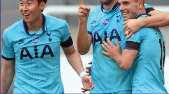  ?? PA ?? Double centurion: Harry Kane scores his 200th club goal to put Tottenham back in front and celebrates with Son (far left) and Lo Celso. He added No 201 in the last minute