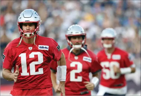  ?? File photo ?? For 20 seasons, Tom Brady (12) was the starting quarterbac­k for the New England Patriots and he led them to six Super Bowl victories. With Brady gone, second-year quarterbac­k Jarrett Stidham (50) moves into the spotlight.