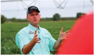  ?? (Special to The Commercial/Ryan McGeeney/University of Arkansas System Division of Agricultur­e) ?? Travis Faske, extension plant pathologis­t for the University of Arkansas System Division of Agricultur­e, is shown during the 2018 Soybean College at the Newport Extension Center. He will be among presenters at the Tri-State Soybean Conference Jan. 6 in Dumas.