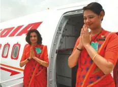  ?? Bloomberg ?? As per the deal with the India Government, the Tata Group ■ will retain Air India staff for a 12-month period.