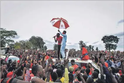  ?? Photo: Stringer/afp ?? Panda gari: Ugandan politician Bobi Wine (above) during a rally in November, before he was arrested; Owen Martin Muwanga and Tomusange Ssebungawo (below) are among the thousands of opposition supporters who Bobi Wine claims have been detained or abducted, allegedly by security forces.