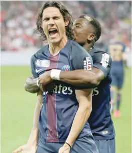  ?? — Reuters ?? Edinson Cavani of Paris Saint Germain reacts after scoring against AS Monaco .