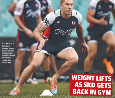  ?? Picture: AAP
NICK WALSHAW ?? EASING BACK: Roosters winger Shaun Kenny- Dowall takes part in a training session in Sydney yesterday.